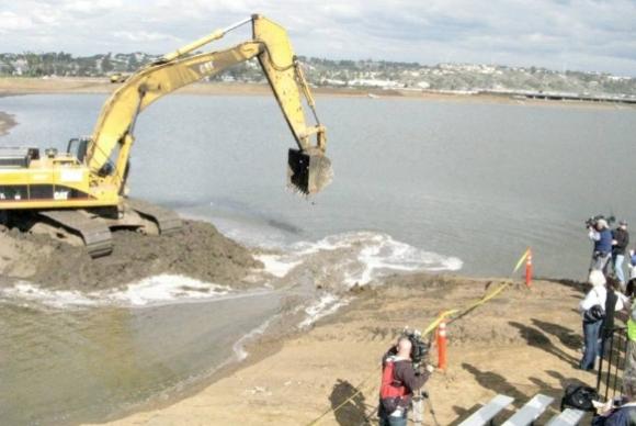 Excavator dozer working by the ocean